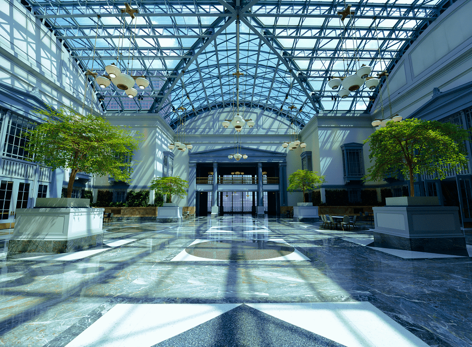 Modern indoor atrium with glass ceiling and greenery.
